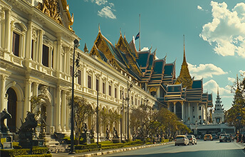 Exterior view of the Grand Palace in Bangkok, Thailand, featuring ornate traditional Thai architecture with golden roofs and intricate details on a sunny day.